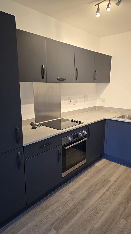 A navy fitted kitchen left clean and ready after an end of tenancy clean